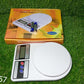 Stylish digital kitchen scale with a wide weighing platform.