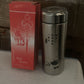 A hand holding the portable 380ml Mini Stainless Steel Water Bottle, ready for use.