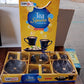 The Sweet Buzz seashell ceramic cup set displayed in its packaging, ideal for gifting.