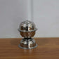 Agarbatti burning in a Lotus incense holder, creating a serene ambiance.