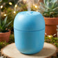 The compact USB Air Humidifier placed on a desk next to a laptop, highlighting its office suitability.