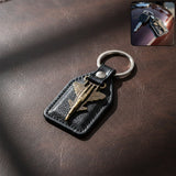 Aircraft design metal keychain with fighter jet emblem on leather-finish base