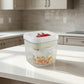 Compact food storage box with durable plastic and red lid