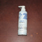 Lifestyle image of Hydrating Aqua Face Wash bottle in bathroom setting