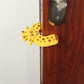 Side profile of the door stopper, showing its low-profile wedge shape.