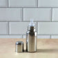 Soft silicone nipple on a stainless steel infant milk bottle
