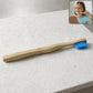 Sustainable wooden toothbrush with soft blue bristles and natural handle