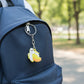 Close-up of banana shaped cartoon keychain with smooth finish and detailed design