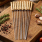 Long stainless steel skewers with wooden handles for outdoor grilling