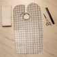Adjustable neck closure on barber cape for secure fit during hair trims