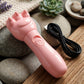 Cute bear electric hand massager showing light indicator during operation