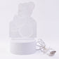 Teddy bear LED Night Lamp glowing softly in dark room