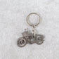 Motorcycle silhouette keychain featuring a reinforced link chain for extra durability.