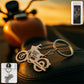 Sleek metal motorcycle keychain with a robust split ring for securing keys.