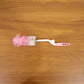 Bottle cleaning brush in use with 360 degree rotary handle