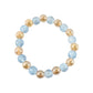 Display of crystal beaded dual-tone stretch bracelet