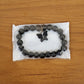 Styled display of beaded bracelet with elegant butterfly charm