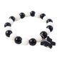 Stylish black and white bracelet displayed on clean white background