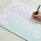 Multiple Polynet premium card envelopes stacked together