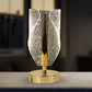Side view of modern crystal table lamp with warm ambient light