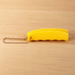 Compact Silicone Bag Carrier conveniently attached to a keyring for easy access.