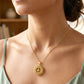 close-up image of golden necklace chain links with intricate design