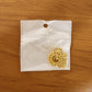 golden pendant with intricate patterns highlighting elegant design