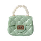 Fashionable quilted mini bag with unique pearl handle detail