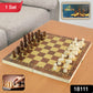 Top-down view of the open wooden chess board with polished brown and yellow chess pieces.