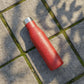 Side view of red 1000ml insulated stainless steel water bottle