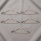 Sturdy plastic clothes hangers for daily wardrobe use