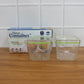 Food storage containers in use holding nuts and spices
