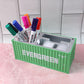 Container-style desk organizer with multiple compartments for small items.