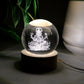 Detailed view of the illuminated 3D Ganpati idol inside the crystal ball, showing its radiant effect.