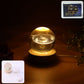 3D crystal ball night lamp glowing with warm LED light on wooden base