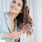 Close-up of flexible bristles on curved vented hair brush for easy detangling