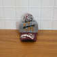 Lifestyle shot of woman wearing woolen baseball cap during winter