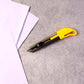 Angled view of heavy-duty utility cutter knife