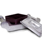 Decorative silver storage box with intricate patterns for organizing treats.