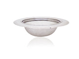 Stainless steel sink strainer effectively catching food particles in a kitchen wash basin drain.