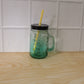 Mason Jar with Handle filled with a refreshing beverage, ready for enjoyment.