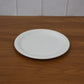 Plastic round dinner plate in use serving Indian meals
