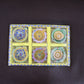 Brightly colored decorative clay diya with traditional motifs painted on it