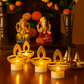 Warm LED light from golden diya shaped tealight candle
