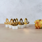 Golden diya LED tealight candle side view