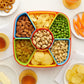 Side angle of dry fruit box filled with nuts and candies in BPA-free organizer