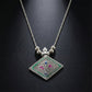 Ethnic oxidised silver finish pendant necklace displayed on white background