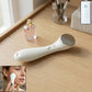 Angled view of portable facial massager device