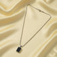 Side view of men's durable stainless-steel pendant chain with black pendant