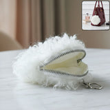 Soft fluffy mini coin purse close-up showing faux fur texture and zipper